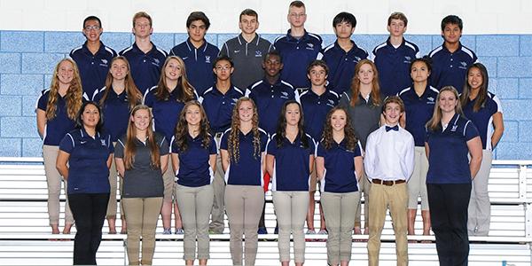 Sophomore Blake Frier, the only one in white, smiles for his group picture with his team.