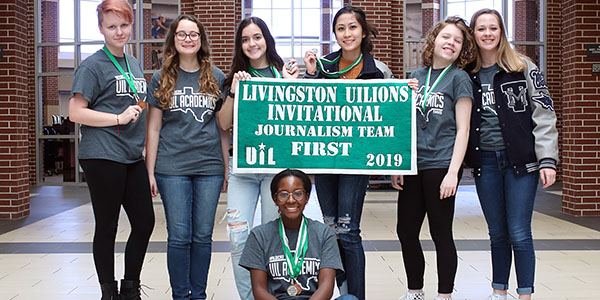 The journalism UIL team with their first-place banner.