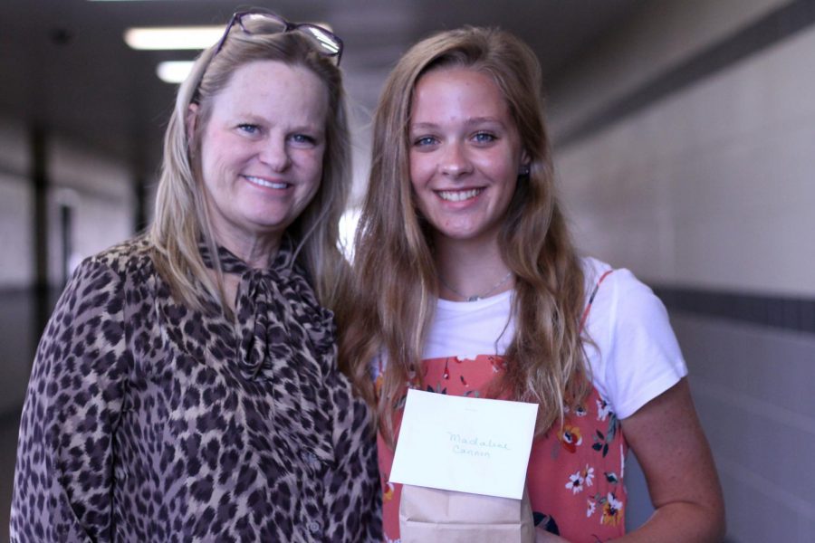 Along with several other teacher-senior pairs, English teacher Tancy Juliano brought a small gift to her adopted senior, Madaline Cannon, to commence the senior adoption program.