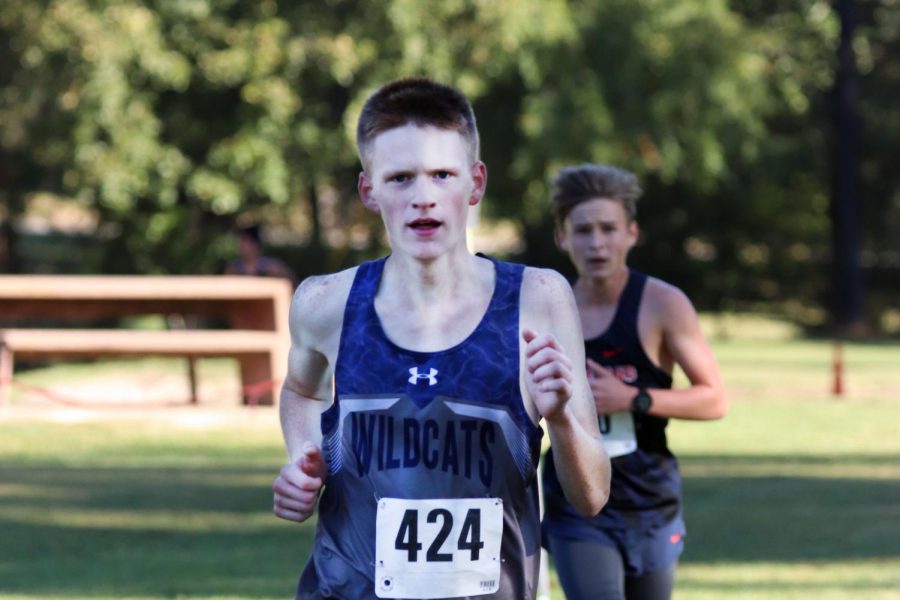 Junior Matthew Cazedessus heads for the finish line at a cross country meet.