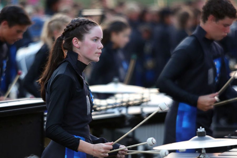 As the marching band roars behind her, senior Abby Cascarelli plays the marimba at the
Langham Creek football game. “I love everyone in the front ensemble and performing with
them is exhilarating,” Cascarelli said. The Wildcats won the football game and have only lost one game this
year.