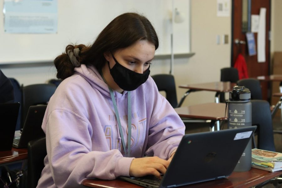 A student works diligently in her fourth period AP Research class. Finals week for all classes is set to begin Monday.