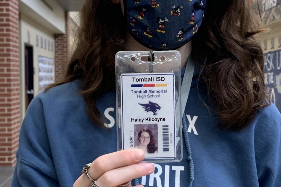 A student poses with her SMART tag ID, received at the beginning of the school year.