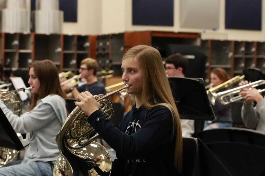 Junior horn player Hannah Jones rehearses in the new band facility. 