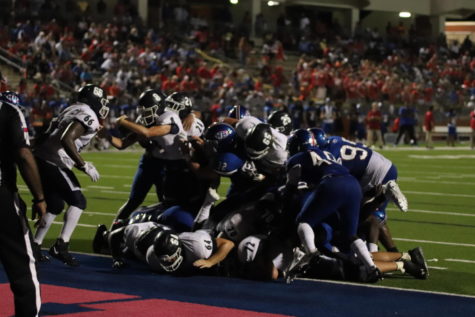 Junior Reed Odell dives over the goal line for a touchdown in the third quarter against West Brook.