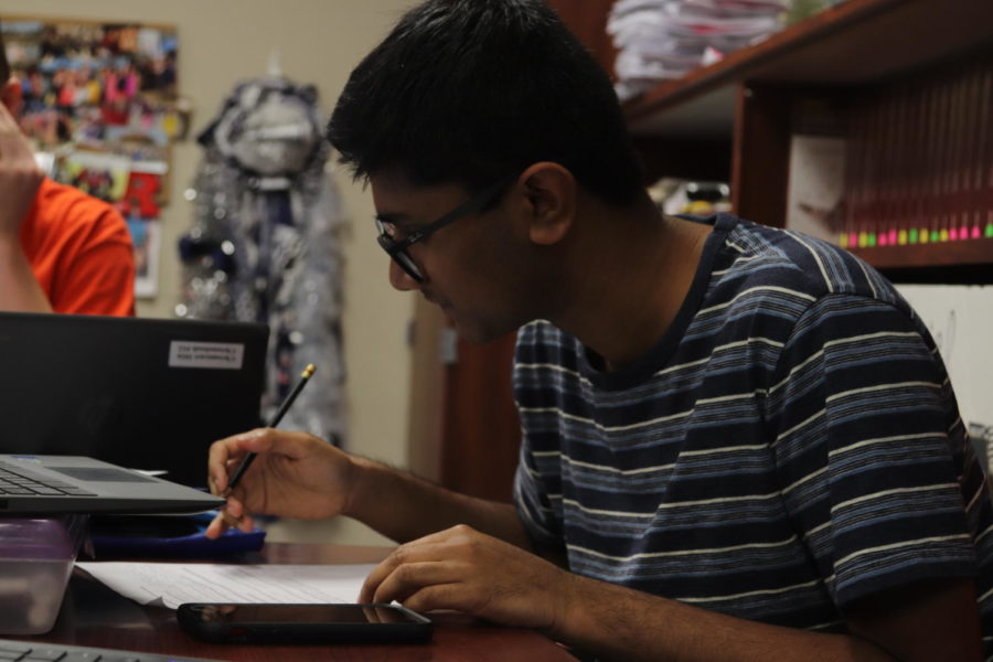 A senior works on an assignment during his AP Government class