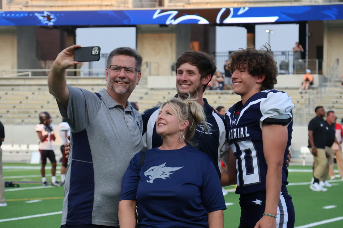 A family takes selfie with their new senior